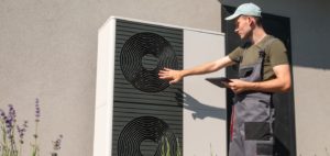 A,Technician,In,Work,Overalls,Is,Seen,Adjusting,An,Outdoor